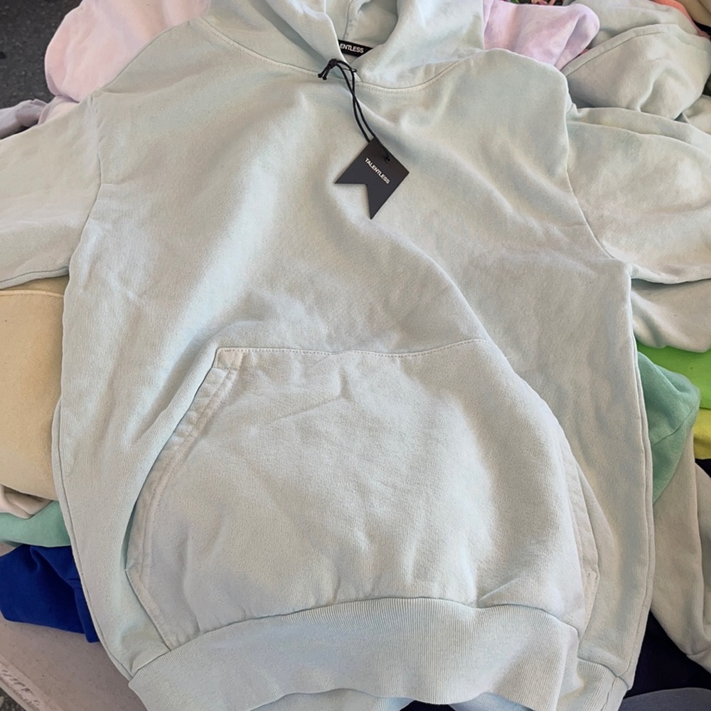 Talentless sweaters have XS, large , X-large